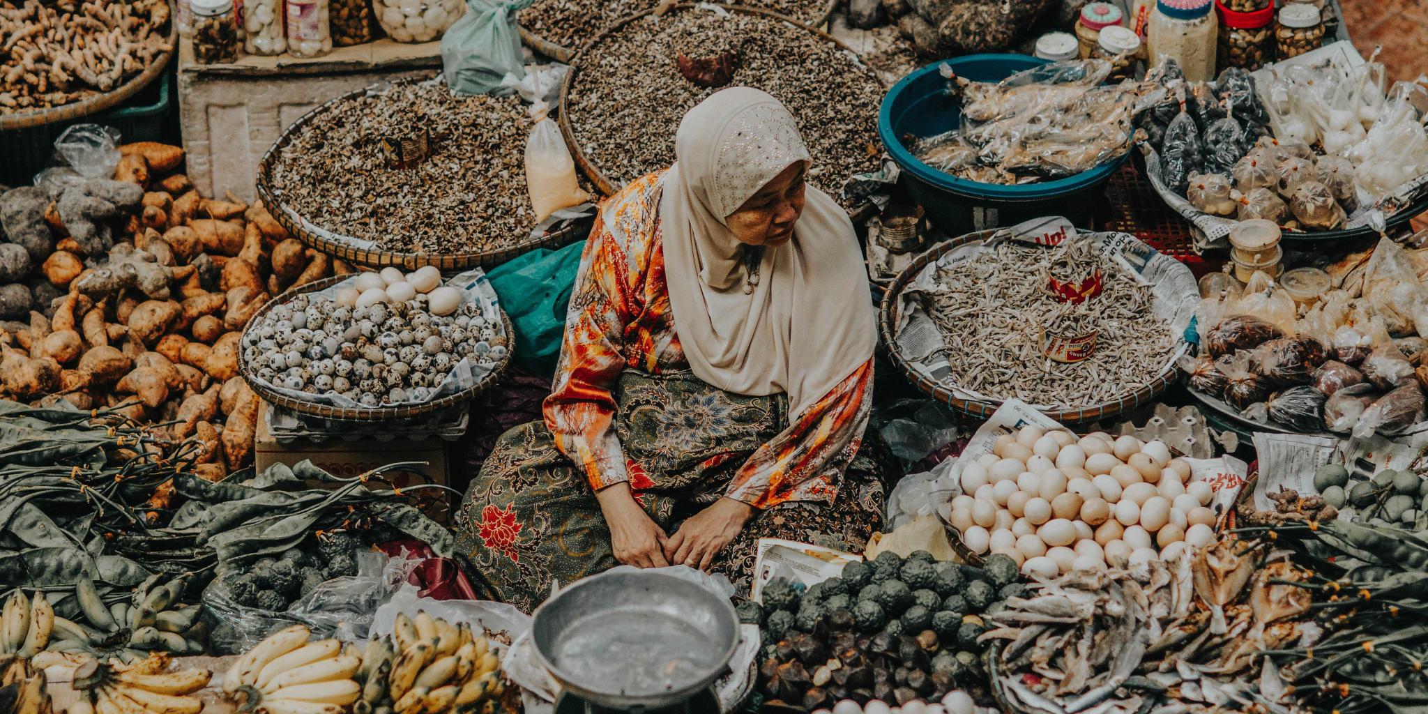 Old woman selling at the market in Malaysia