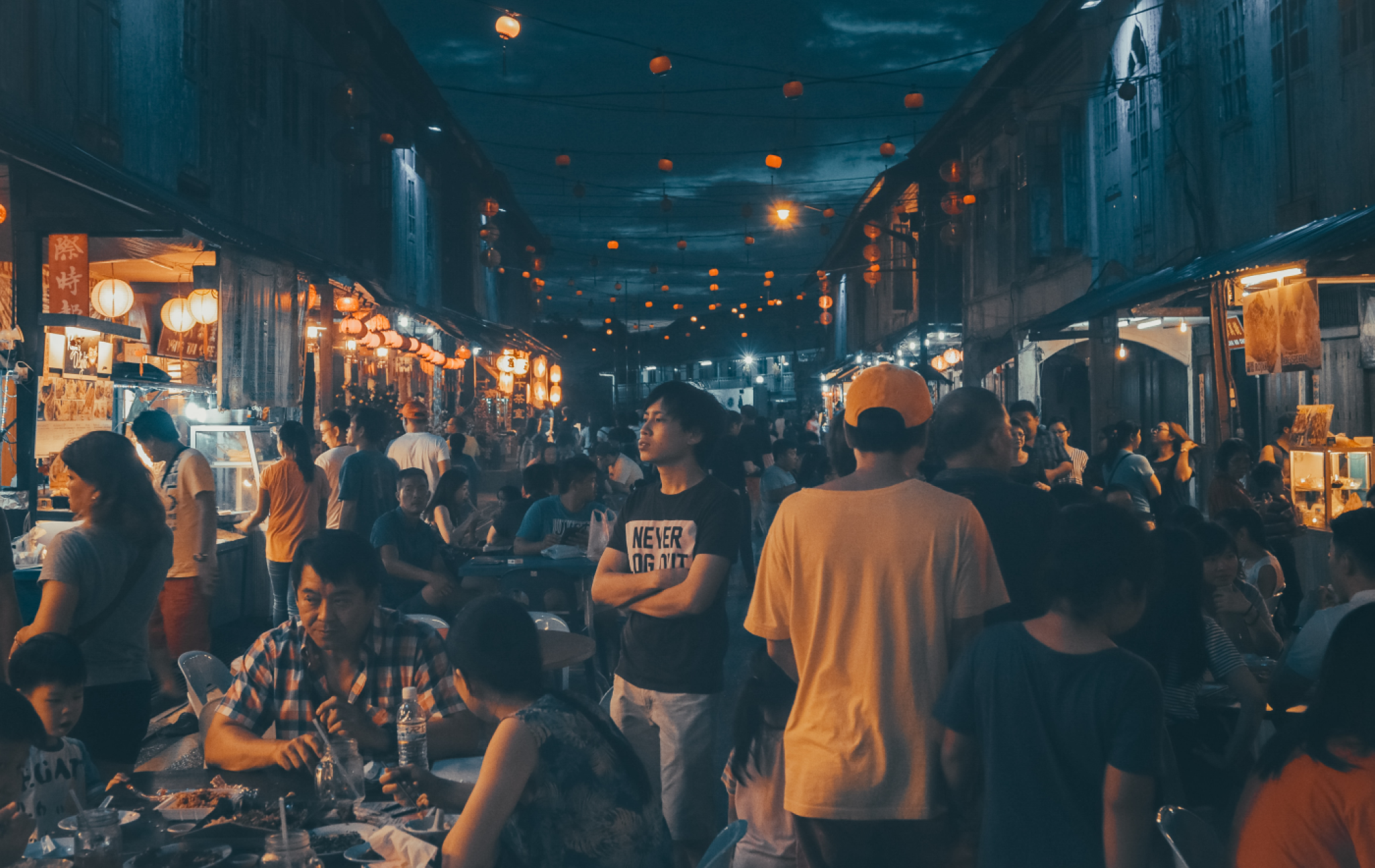 People gathering near street food stalls at Sarawak Night Market