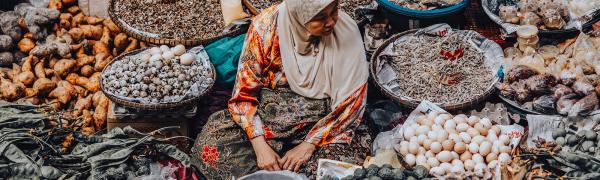 Malaysian woman in market stall Malaysian woman in market stall