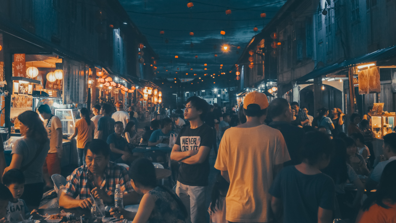 People gathering near street food stalls at Sarawak Night Market